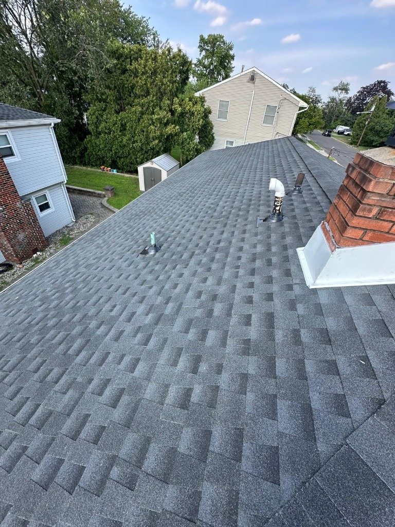 Complete architectural shingle roof replacement with chimney flashing